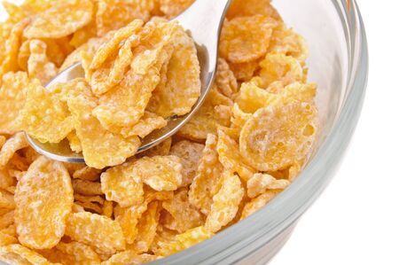Macro shot of corn flakes on a silver  spoon