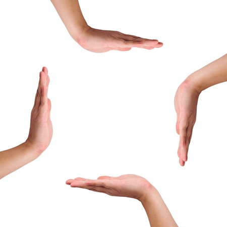 Four hands isolated on white created a copy space in the middleの写真素材