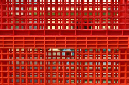 Red plastic crate as a backgroundの写真素材