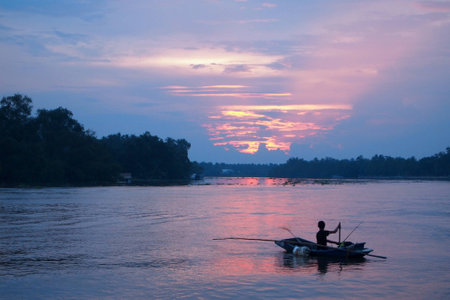 Locals fishing boats off the eveningの写真素材