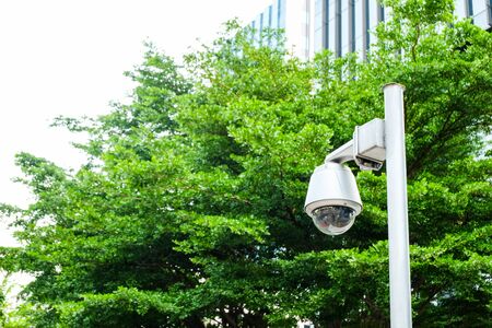 Security surveillance camera in front of office building walk way. Record situation around area...