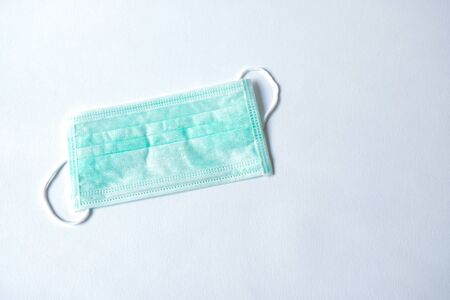 Green color Medical mask for protection against flu and other diseases. Surgical protective mask....