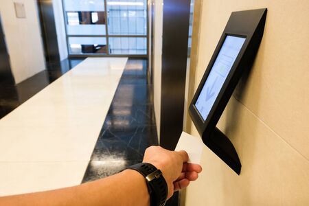 RFID reader in front of the elevator which only allow authorized person in the building to use. One of security feature in modern condominium, apartment or  office buildingの写真素材