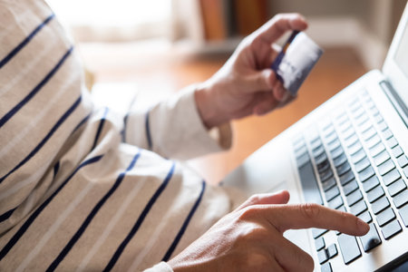 Selective focus at men hand pressing enter on keyboard. Close up shot at men while enter security...