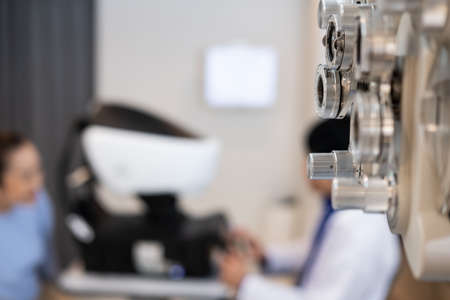 Selective focus at Optometry frame equipment. With blurred background while optometrist examine eye...