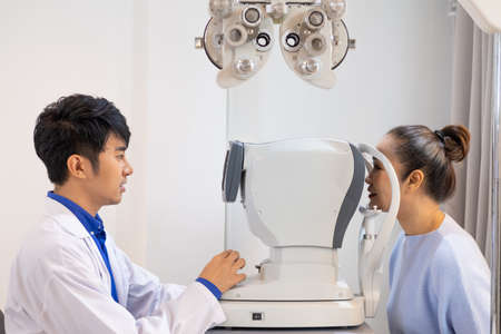 Selective focus at Optometry frame equipment. While doctor using penlight and subjective refraction...