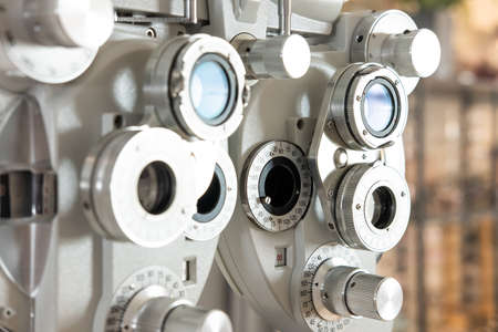 Selective focus at Optometry frame equipment. With blurred background while optometrist examine eye...