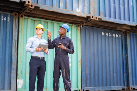 Selective focus at African black worker while talk and having discussion with supervisor and inspect...