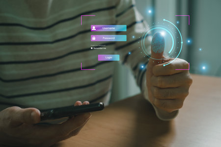 Selective focus at people hand while using smartphone to type password credential to login to...
