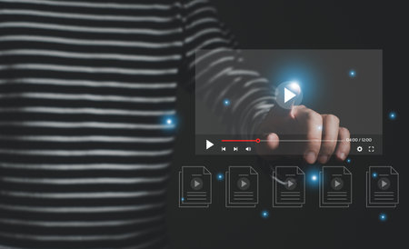 Selective focus at finger that push on press play button for start online entertainment for on demand video streaming service that online over internet which include movie or musicの写真素材