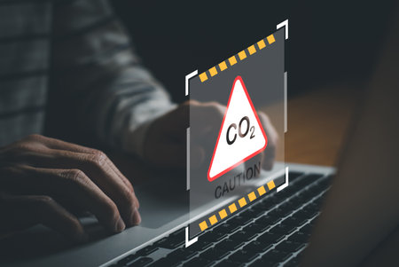 Entrepreneur hand point at digital screen dashboard while control and reduce carbon emission for...
