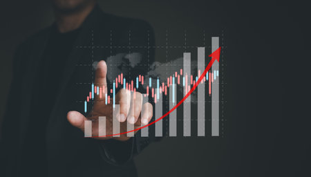Business person point at infographic graph while analyze for interest and inflation rate that have potential growth and rising percentage with red arrow. Global economic and financial issue.の写真素材