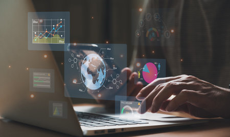 young entrepreneur using big data analysis and cloud technology to collect customer data and display on application dashboard from digital tablet to understand sale forecast and marketing planの写真素材