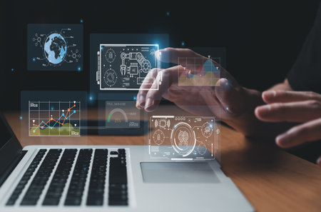 Business person dress in formal suit holding an icon that show the component of Business that do digital transformation for industrial or manufacturing vertical.の写真素材