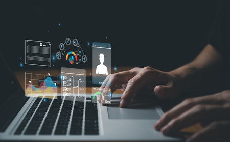 young entrepreneur using big data analysis and cloud technology to collect customer data and display on application dashboard from digital tablet to understand sale forecast and marketing plan.の写真素材