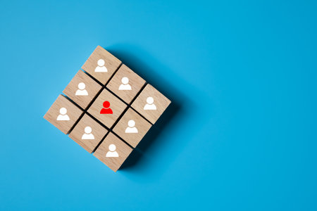 Selective focus at wood brick with icon of target customer with arrow pointing on target. SEO tools which can increase sale and revenue. Marketing icon concept on plain background with copy space.の写真素材