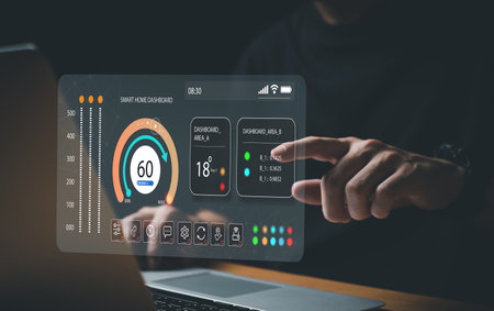 People hand using smartphone or computer laptop to access smart home application from internet wireless connection to control and monitoring smart device inside of the house. Internet of thingsの写真素材