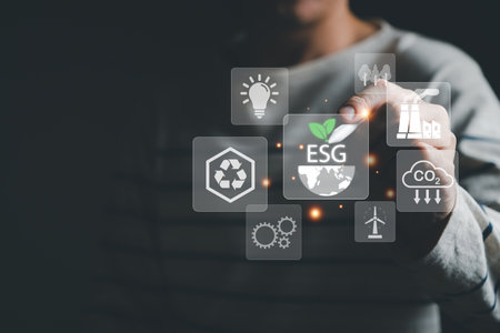 Entrepreneur hand point at digital screen dashboard while control and reduce carbon emission for global friendly business or ESG. Business with environment concern, carbon credit and zero emission.の写真素材