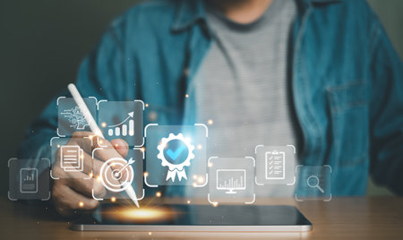 Entrepreneur using electronic devices for store customer data to gain customer insight in order to create marketing campaign that can help to increase sale and identify potential customer.の写真素材