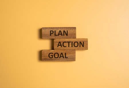 Wood brick with text plan, action and goal that show business strategy and planning process by set goal and implement process to increase performance. Minimal business concept with copy space.の写真素材