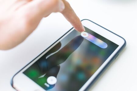 Finger touch and will close smartphone.の写真素材