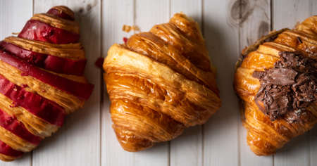 Croissant bakery on white wooden tableの写真素材