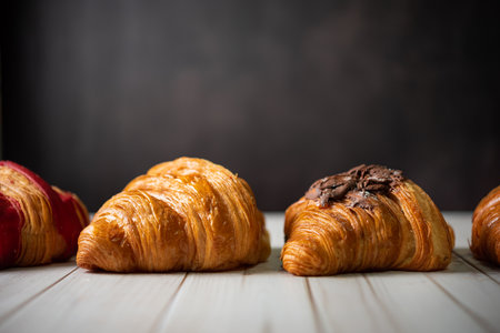 Croissant bakery on white wooden tableの写真素材