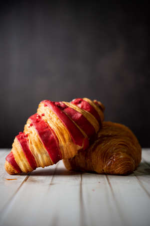 Croissant bakery on white wooden tableの写真素材