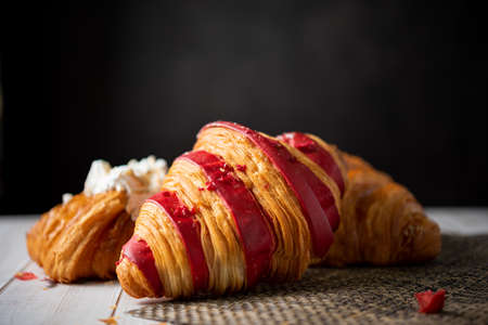 Croissant bakery on white wooden tableの写真素材