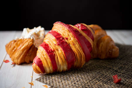 Croissant bakery on white wooden tableの写真素材