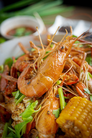 Spicy seafood bucket, Cook spicy shrimp mixed seafood Thai style, Thai foods.;の写真素材
