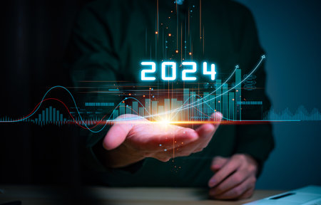 Businessman hand holding the increase arrow graph corporate future growth year 2023 to 2024. New Goals with Plans and Visions for Next Year 2024, Opportunity, challenge and business strategy.の写真素材