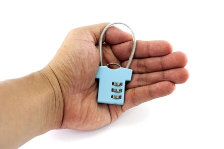 Security concept with locked-key on one handの写真素材