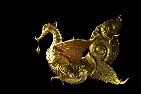 Traditional Thai style swan sculpture isolated on black background の写真素材