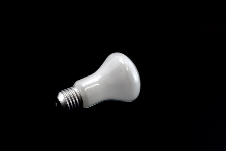 White lamp isolated on a black background  の写真素材