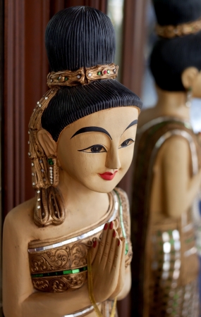 Sawatdee Lady - Wooden Statue of a traditional Thai greeting lady の写真素材