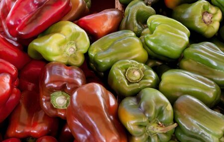 Red and Green belll peppers, natural background 
