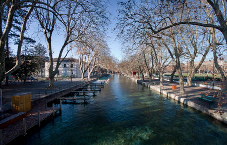 The canal in Annecy, France ringed by the beautifully trees の写真素材