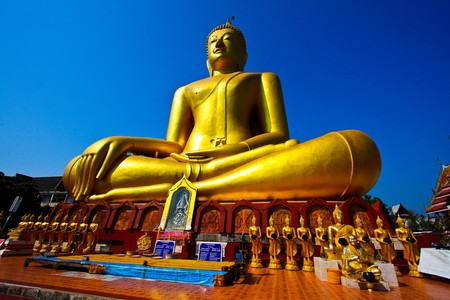 Golden big buddha in Sukhothai province of Thailandの写真素材