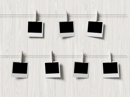 empty polaroid photos frames on wood background, concept artの写真素材
