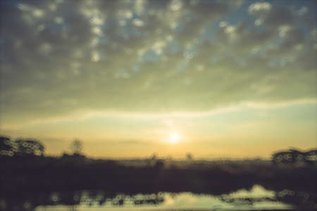 Beautiful sunset at a lake, abstract background, nature backgroundの写真素材