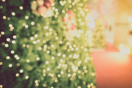 Gold Christmas background of de-focused lights with decorated tree, Christmas backgroundの写真素材