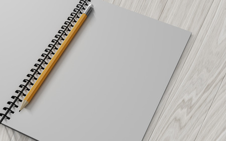 pencil on checked notebook on wood background, stationary objectの写真素材
