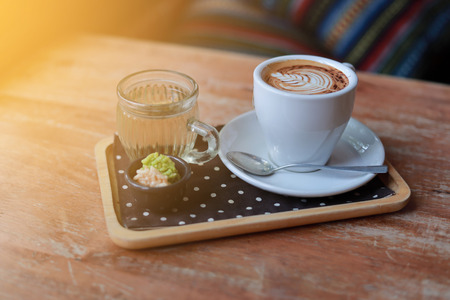 Hot coffee with foam milk, a cup of coffeeの写真素材