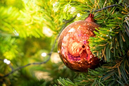 Gold Christmas background of de-focused lights with decorated tree, Christmas backgroundの写真素材