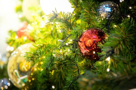 Gold Christmas background of de-focused lights with decorated tree, Christmas backgroundの写真素材