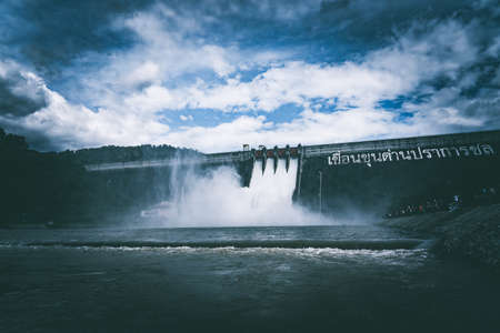 The dam door open to let the water fall into the riverの写真素材