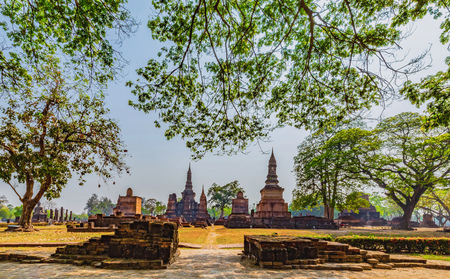 Sukhothai historical park and surrounding area in the midday and twilightの写真素材