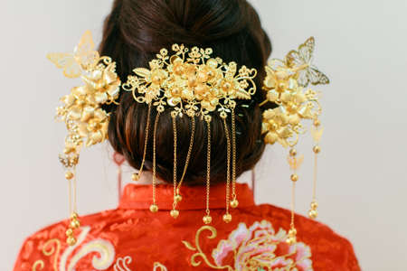 Close up of the intricate ornaments on a bride of a traditional chinese weddingの写真素材