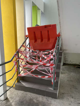 Penang, Malaysia - August 20, 2020 : View of a red tapes and barricade to prevent access to a staircase due to the covid19 pandemic at Gelugorのeditorial素材